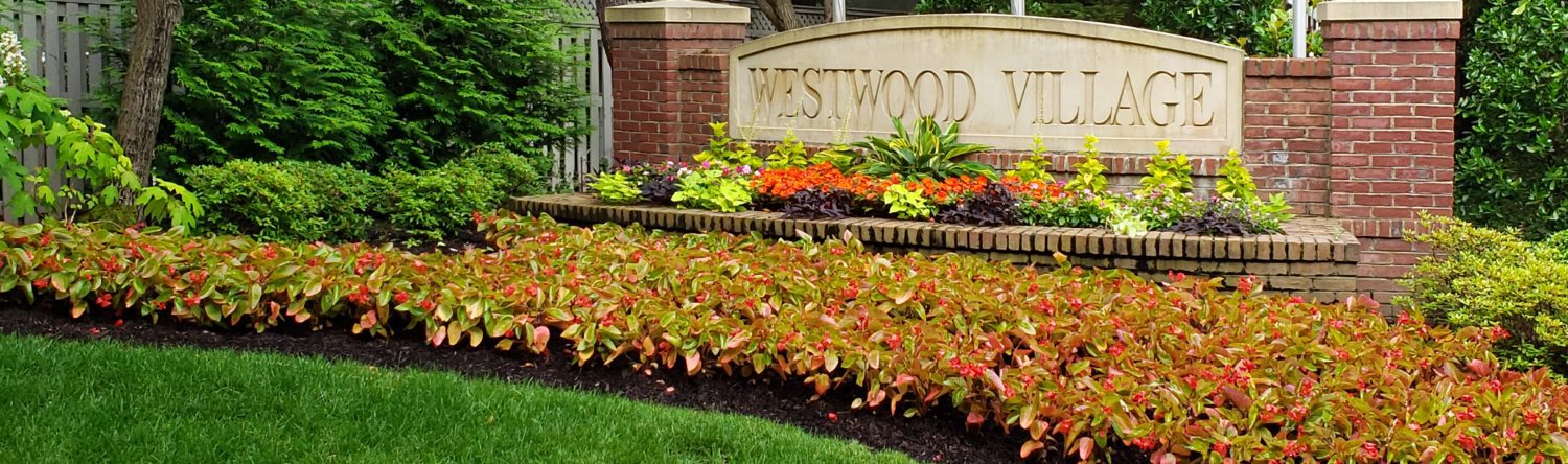 Westwood Village entrance with vibrant landscaping.